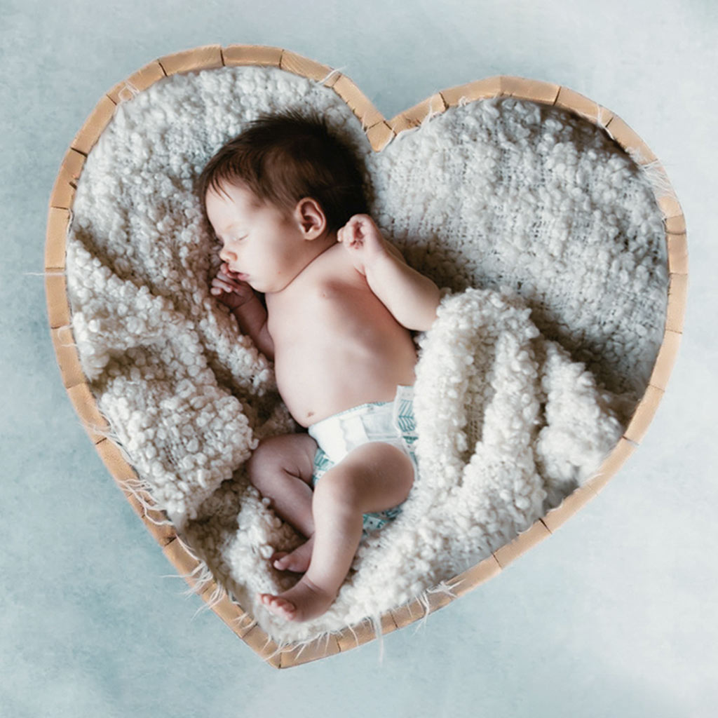 A Child is Sleeping Quietly on a Blanket After Image Manipulation Service
