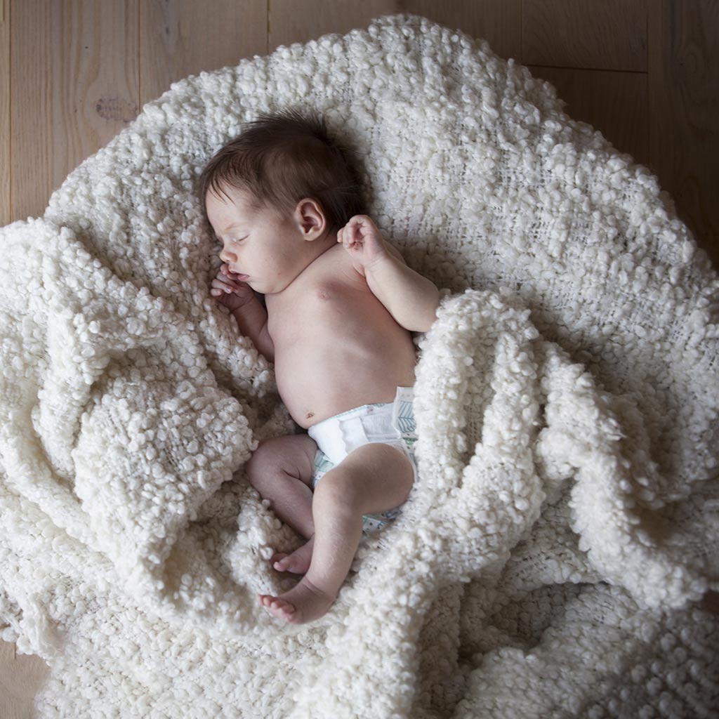 A Child is Sleeping Quietly on a Blanket Before Image Manipulation Service