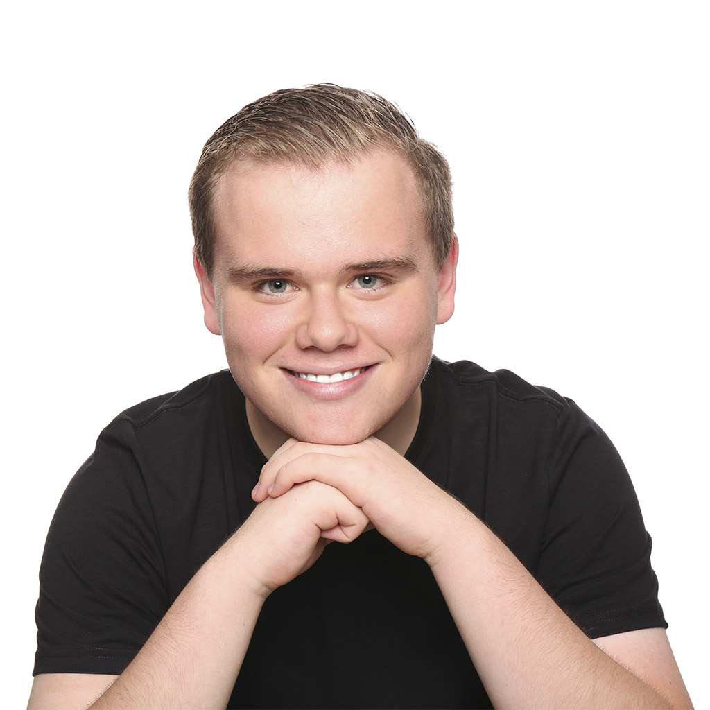 A Boy Is Sitting With A Smile After Background Removal Services
