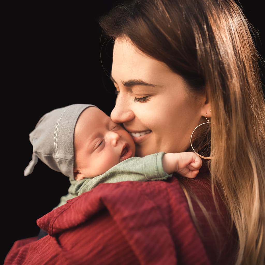 A Newborn and Mother After Photo Background Editing Services